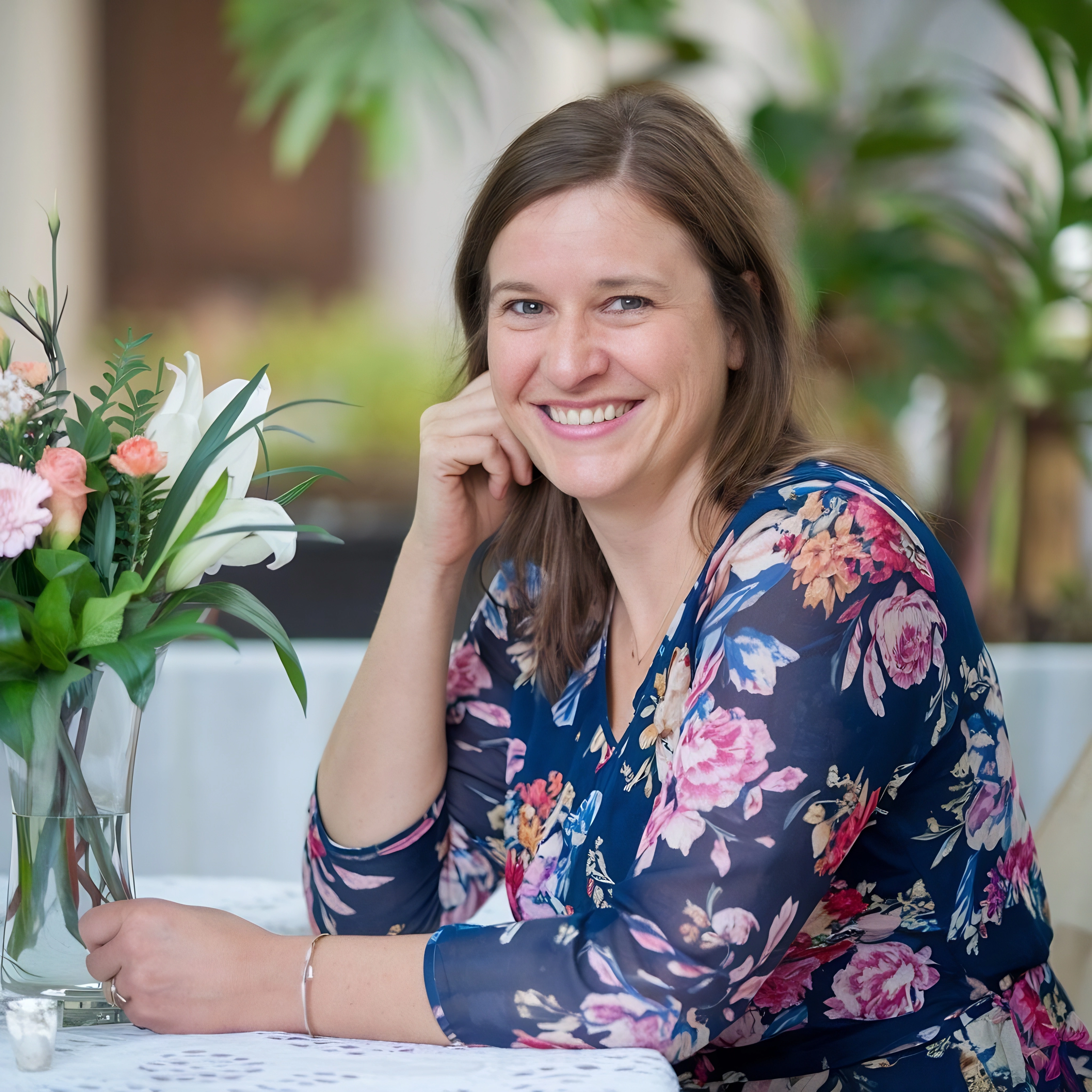 Happy client testimonial woman smiling at table Safe Demo Dallas