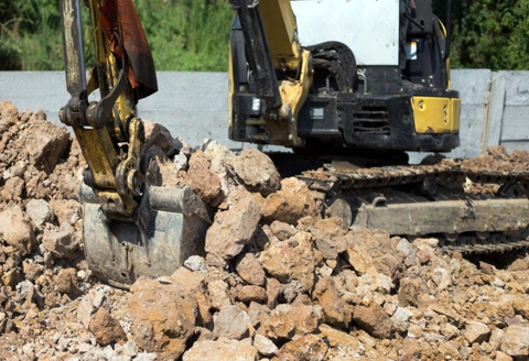 Safe Demo Dallas concrete demolition with jackhammer breaking wall structure
