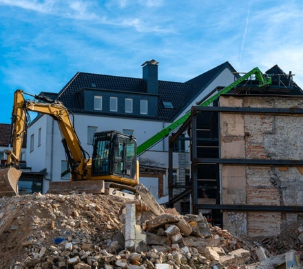 Safe Demo Dallas residential demolition process removing walls and debris from property